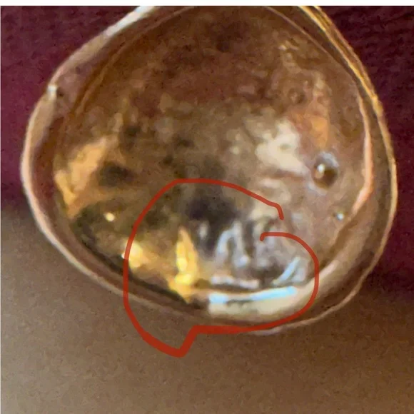14 karat yellow gold cable ring with a beautiful shell hanging